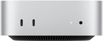 Mac mini, priekšpuse, divi Thunderbolt porti, statusa indikators un austiņu ligzda, melna trapecveida pamatne apakšā, plakana augšdaļa, noapaļoti sāni, taisnas malas, sudraba krāsa