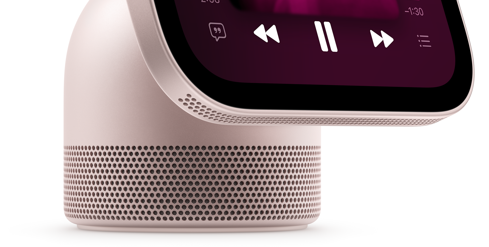 Apple HomeView, rose pink color, close-up view of the perforated speaker grille surrounding the base and along the bottom of the display, screen shows Music app with playback controls